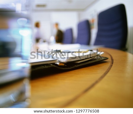 Detail of personal organizer conference room table in office