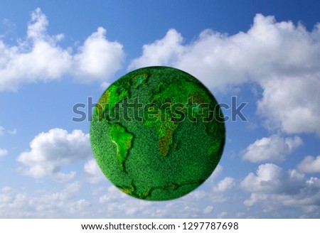 Environmental concept with world map imposed on grass covered globe