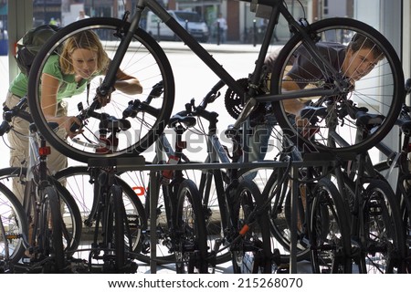 Young couple shopping for new bike in bicycle shop