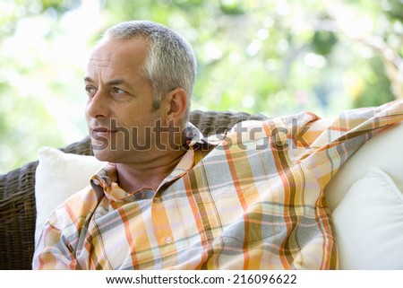 Man on sofa, close-up