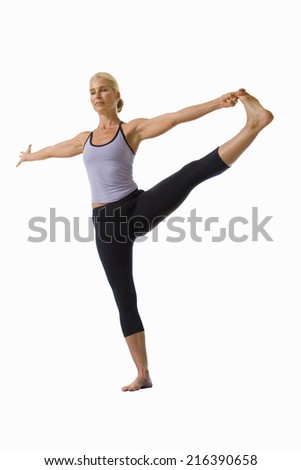 woman holding leg out and balancing, cut out