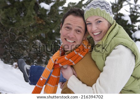 Portrait of mid adult couple in winter setting