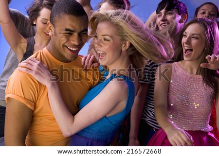 Friends dancing at nightclub