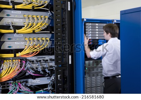 IT technician checking network server