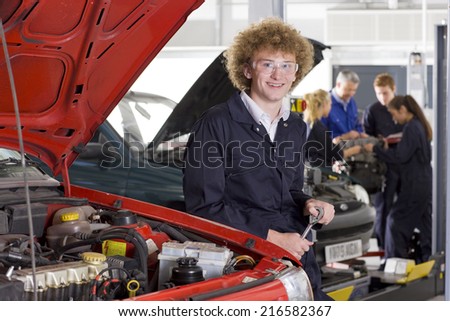 Student repairing car in automotive vocational school