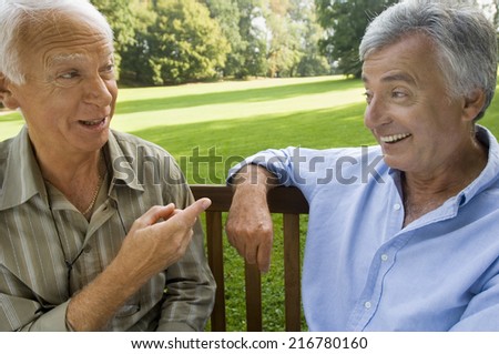 Two elderly men having a laugh.