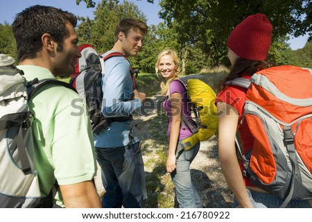 A small group of friends going trekking.