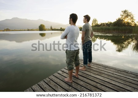 Two men standing on the pier.