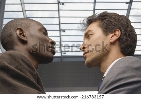 Two businessmen face to face.