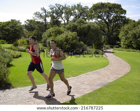 Side profile of two young men running