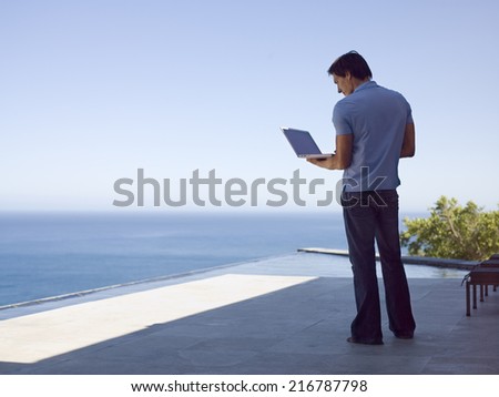 A man using his laptop.