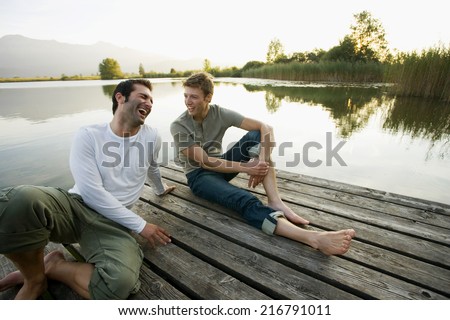 Two friends relaxing on the pier.