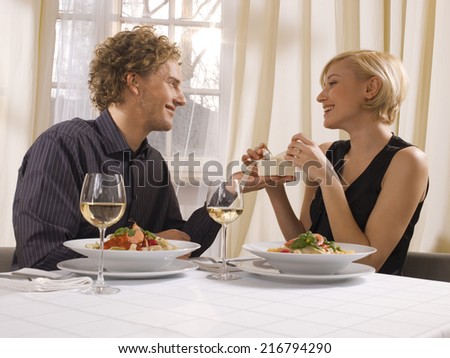 A man giving a present to his girlfriend.