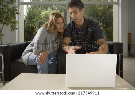Couple looking at computer together