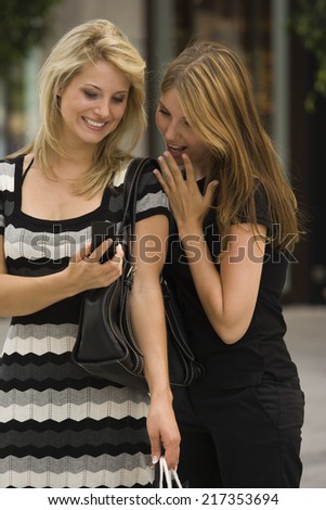 Young women looking at cell phone
