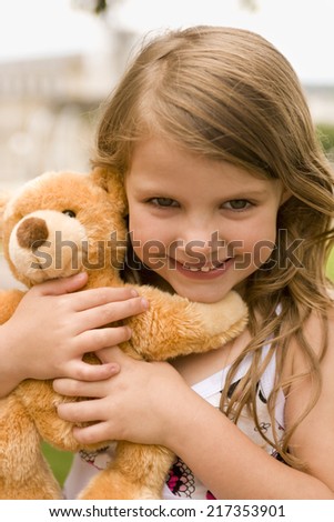 Portrait of a girl with teddy bear
