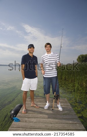 Young men with fishing pole