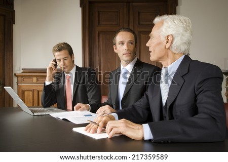 Businessmen in board meeting