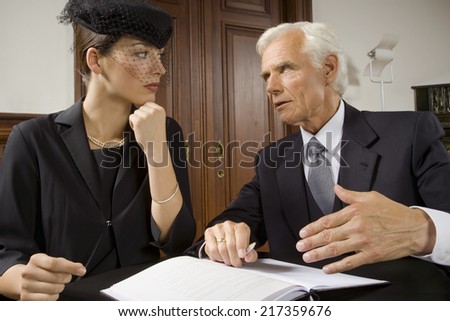 Widow sitting with lawyer