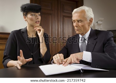 Widow sitting with lawyer