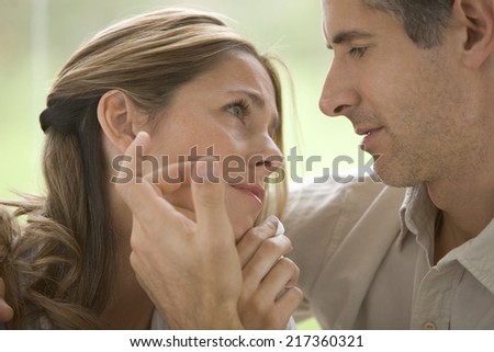 Man comforting woman