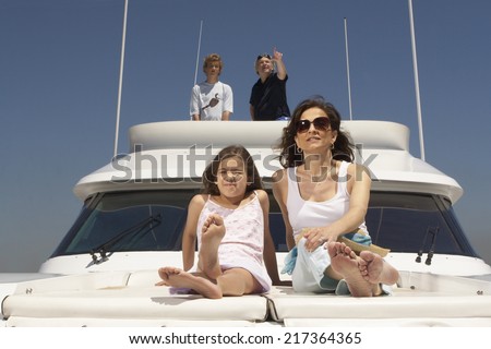 Young family relaxing on boat