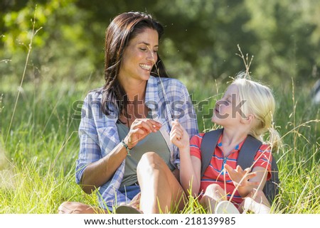 Mother And Daughter Having Fun On Countryside Hike