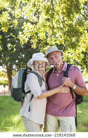 Senior Couple Hiking In Countryside