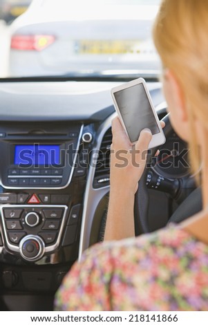 Female Driver Sending Text Message Whilst Driving