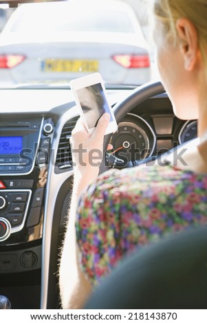 Female Driver Sending Text Message Whilst Driving