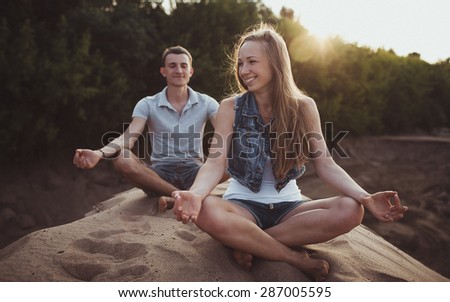 picture of happy couples, men and women outdoor summer practicing yoga