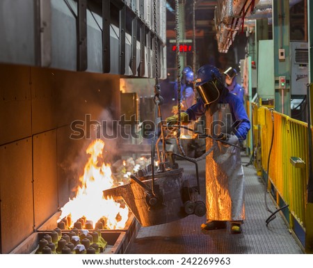 operator pouring automotive part in casting line