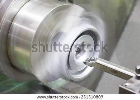 operator turning automotive parts by high precision cnc lathe