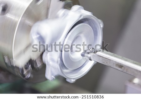 operator turning automotive parts by high precision cnc lathe