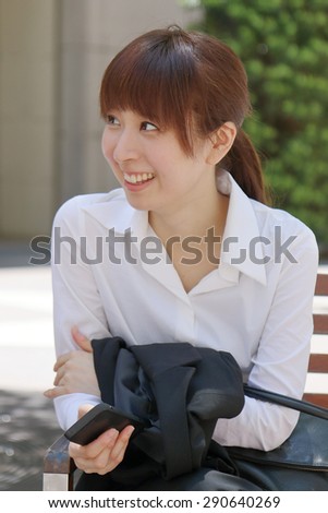 Happy smiling business lady in white shirt