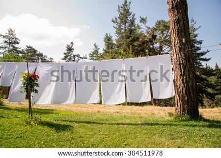Fresh Clean White Towels Drying On Washing Line In Outdoor Stock