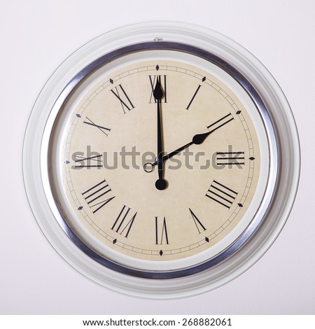 clock with Roman numerals at 2 o'clock