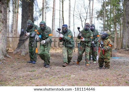 Active family on paintball start game
