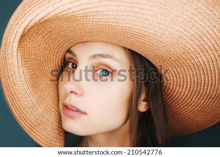 Portrait of sexy woman with hat in studio