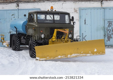 old snow removing vehicle at the vehicle shed