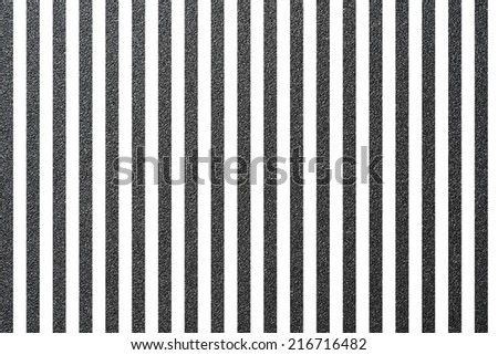 Texture of rough sandpaper with white stripes