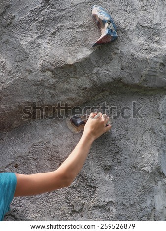 Hand hanging the rock on rock climbing