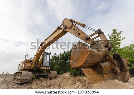 digger, heavy duty construction equipment parked at work site
