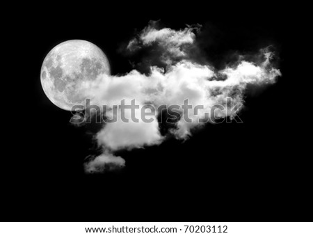 Moon between the clouds in dark nght, a dark night brings a bright, amber moon alive with puffy hazy clouds.