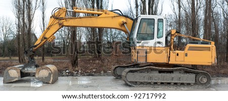 digger, heavy duty construction equipment parked at work site