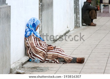 November 3,2013: Tangier, Morocco: The photo was taken around the port.A woman asking for charity