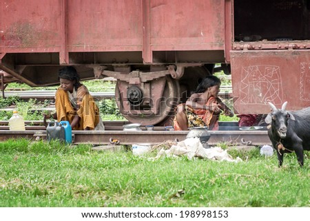 JUNE 26,2012-DHAKA, BANGLADESH: The photo was taken at the train tracks where many poor people have their home there even under trains