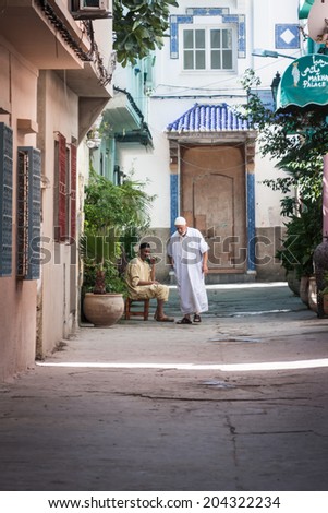SEPTEMBER 15.2013, TANGIER MOROCCO: In the picture we can see two people resting in the shade on a street in Tangier.