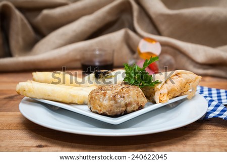 Typical food and fresh Moroccan on wooden table with woven sack