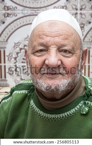 MARCH 1.2015, TANGIER MOROCCO: Portrait typical Arab man with his usual costume, we can see down any street in Tangier in Morocco